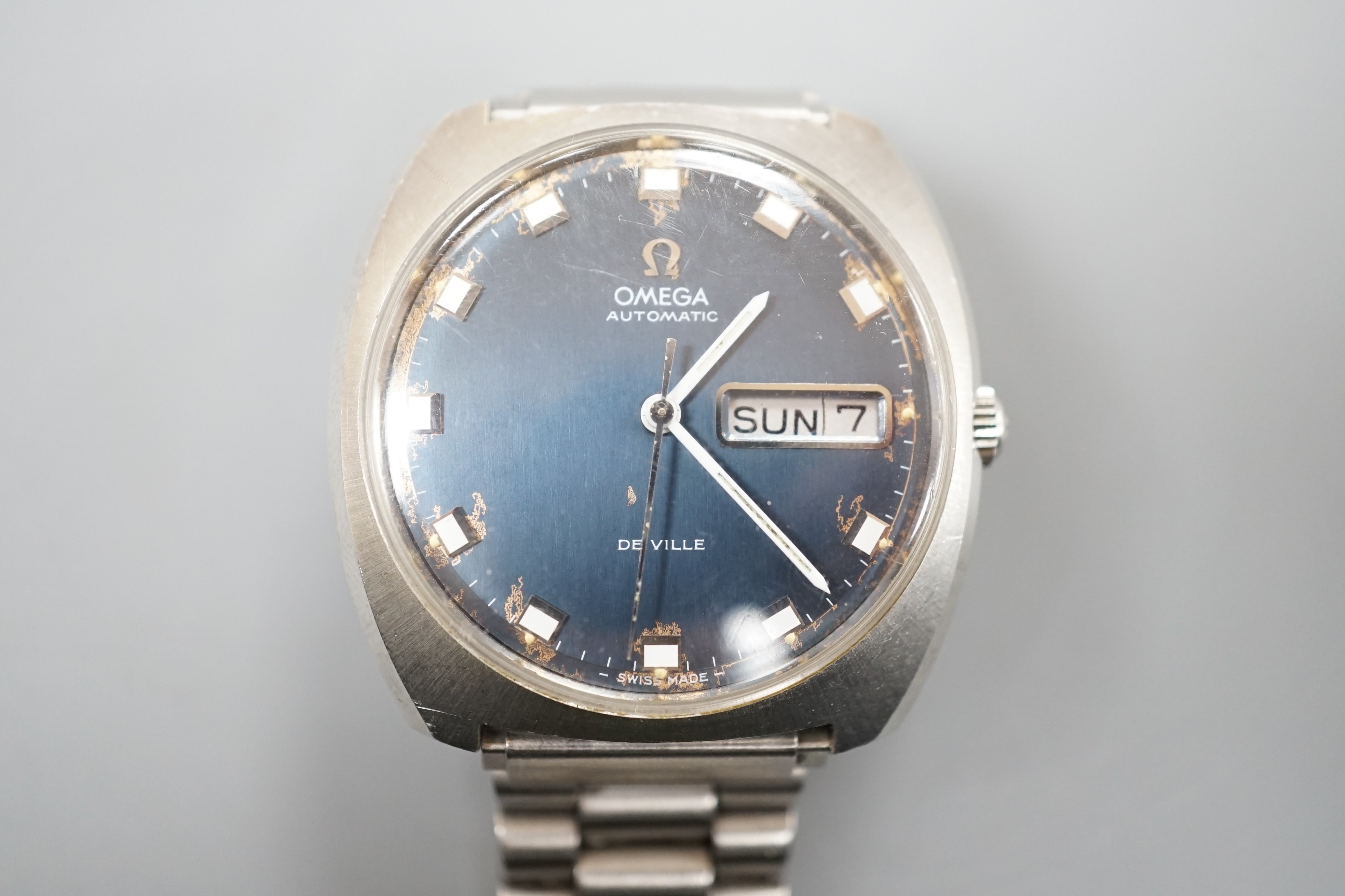 A gentleman's 1960's? stainless steel Omega De Ville automatic day date wrist watch, on associated steel bracelet, case diameter 36mm, no box or papers (dial a.f.).